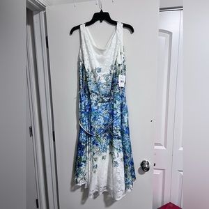 White lace dress with blue floral design